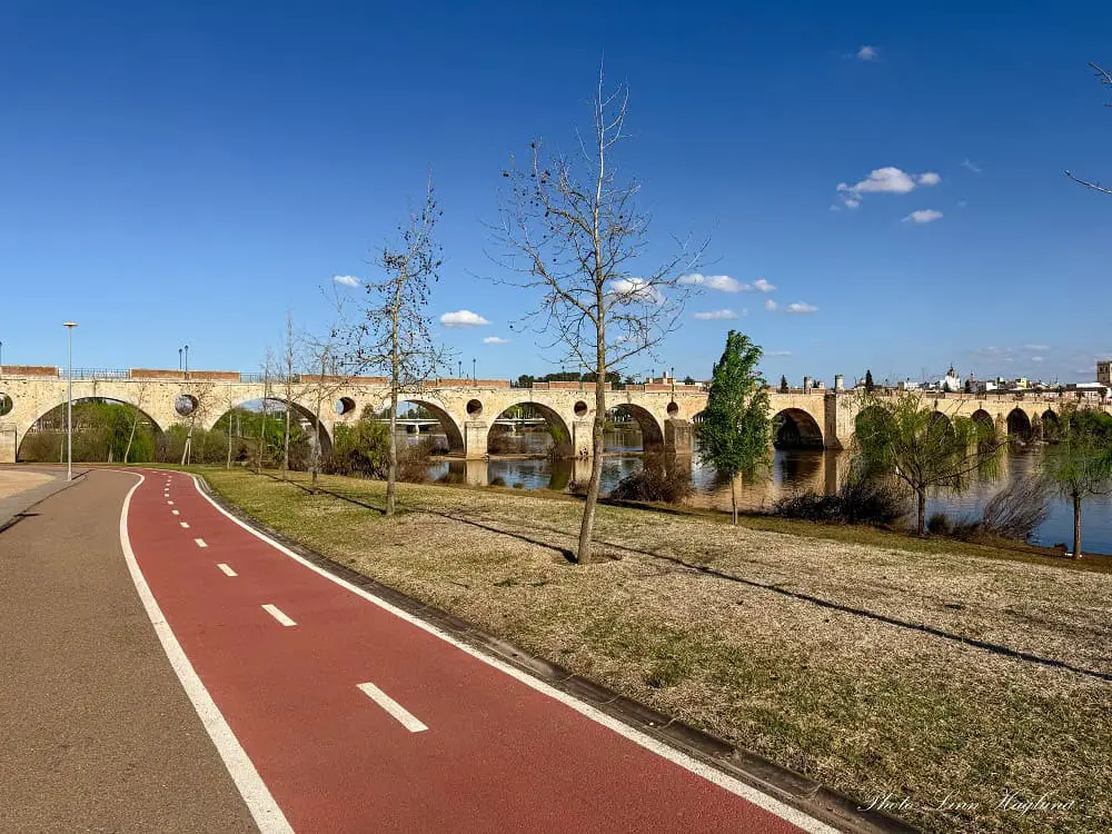 River walk in Badajoz with Puente de Palmas in the background.