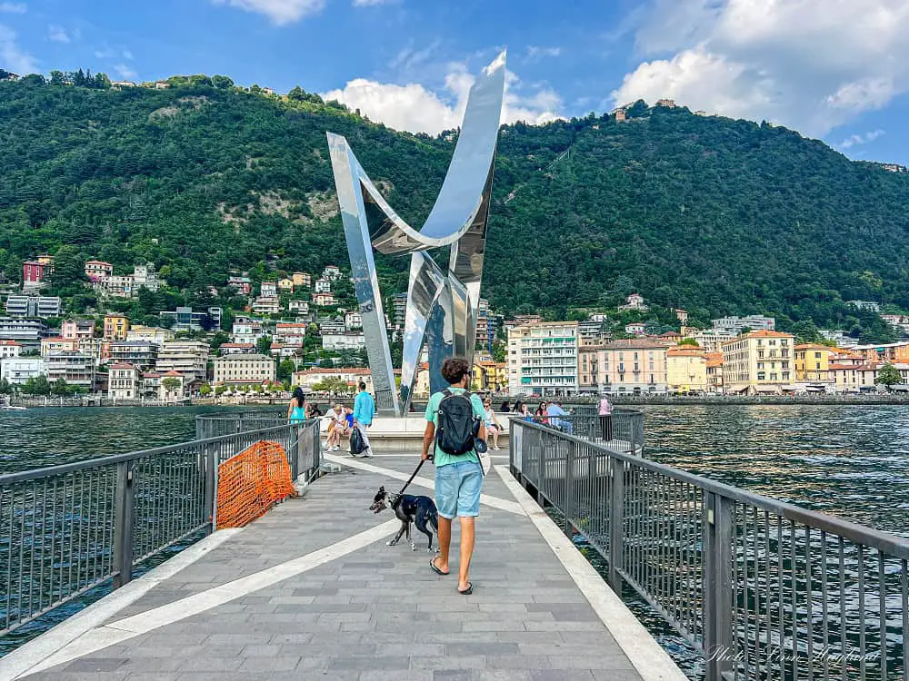 Mohammed and atlas walking towards the Life Electic sculpture with beautiful views of Como. This is one of the best things to do in Como as you get 360 views of the city and the surrounding mountains from the lake.